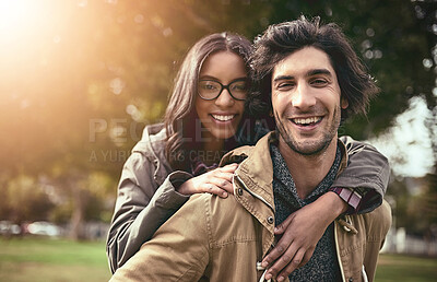 Buy stock photo Couple, piggy back and smile for portrait in park with care, bonding and adventure in spring on holiday. Interracial love, man and woman with hug, playful and outdoor on vacation with game in Toronto