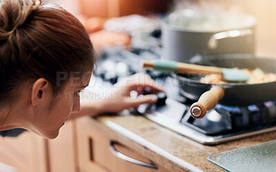 Buy stock photo Woman, cooking and check temperature on stove in kitchen with nutrition, ingredients and heat for meal prep in home. Person, pan and pot with flame, gas and change for food, health and diet at lunch