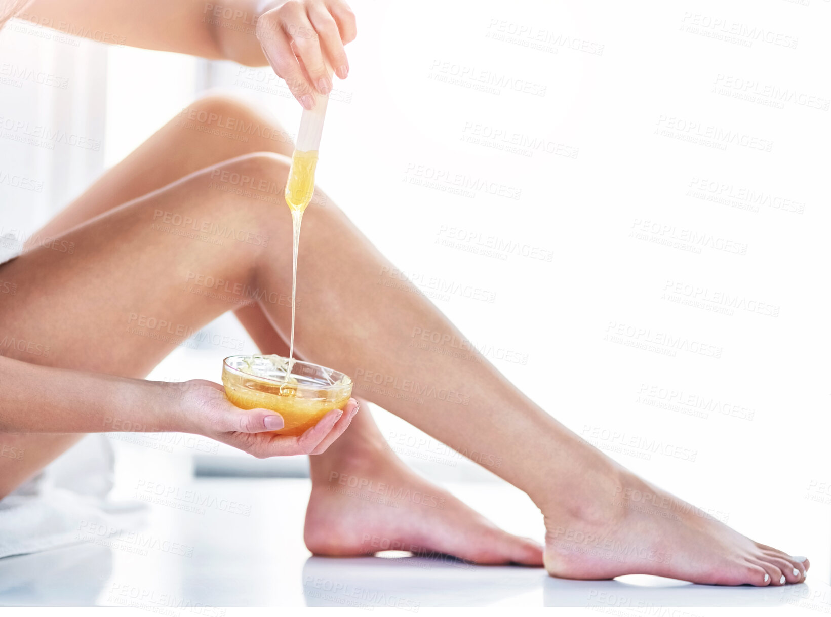 Buy stock photo Hot wax, legs and woman in bathroom for hair removal, epilation and skincare at home. Female person, self care and hygiene with feet for therapy, cosmetics and beauty or smooth skin with treatment