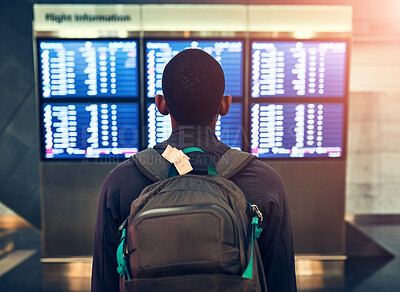 Buy stock photo Backpack, travel and man at airport for schedule or reading flight timetable on vacation. Bag, back or person at airline to check departure information on boarding gate with luggage for holiday trip