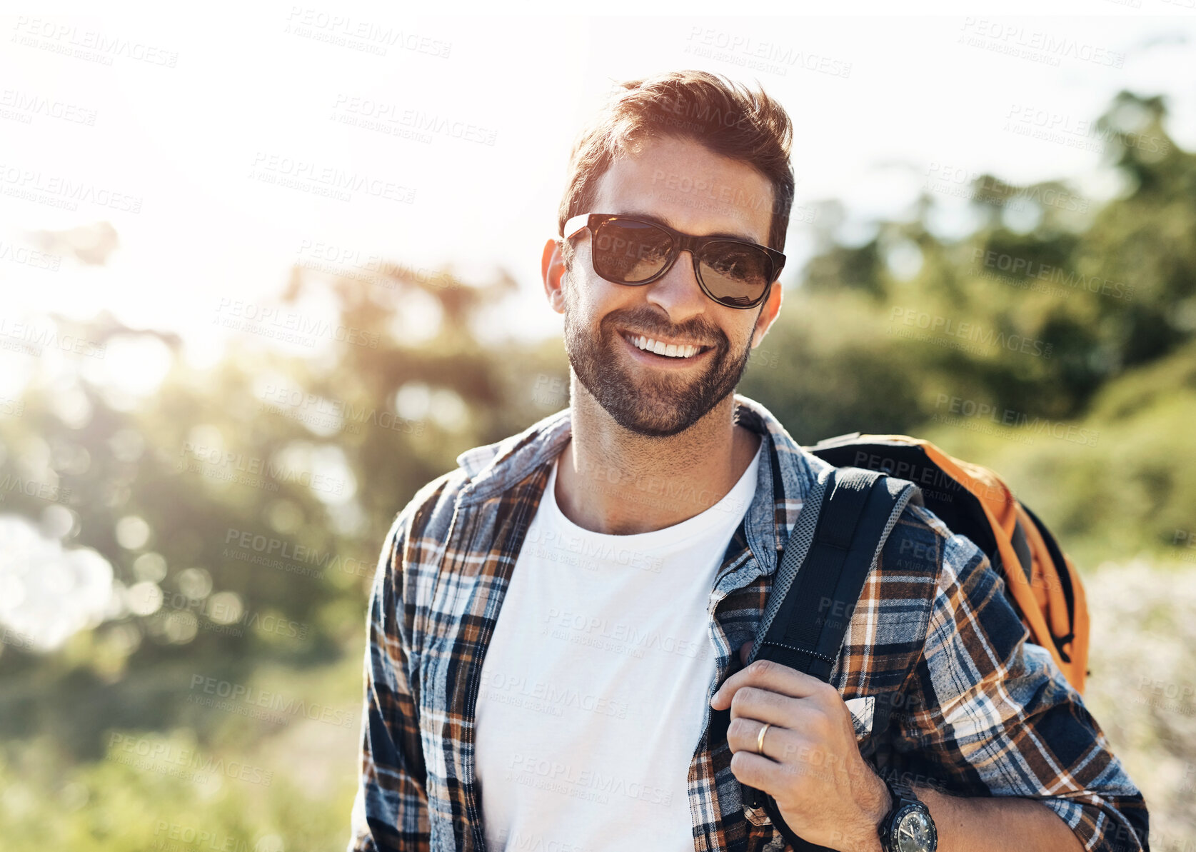 Buy stock photo Smile, nature and man hiking on vacation for adventure, travel or journey with backpack in New Zealand. Happy, sunglasses and male person trekking on outdoor trial or path on holiday or weekend trip.