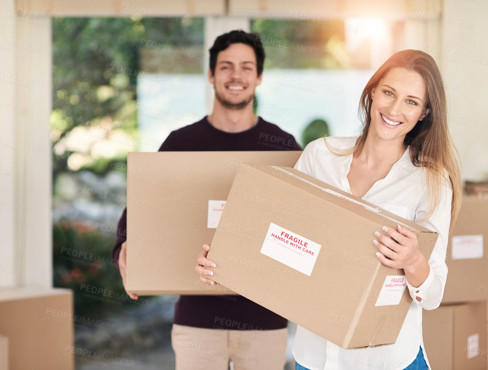 Buy stock photo New home, happy and portrait of couple with box for property, moving day and mortgage purchase. Homeowner, real estate and man and woman with package for relocation, residence and rental apartment