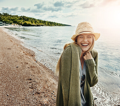 Buy stock photo Relax, laugh and woman at beach on holiday, vacation or travel outdoor on island in Ireland. Ocean, funny and happy person at sea for journey, adventure and tourism trip in nature with summer hat