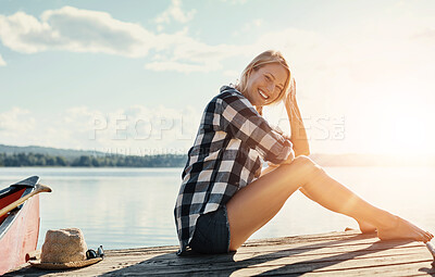 Buy stock photo Woman, relax and portrait outdoor for peace, holiday and travel by lake with happiness or freedom. Female person, smile and sunset in nature for vacation, summer and wellness by pond with mindfulness