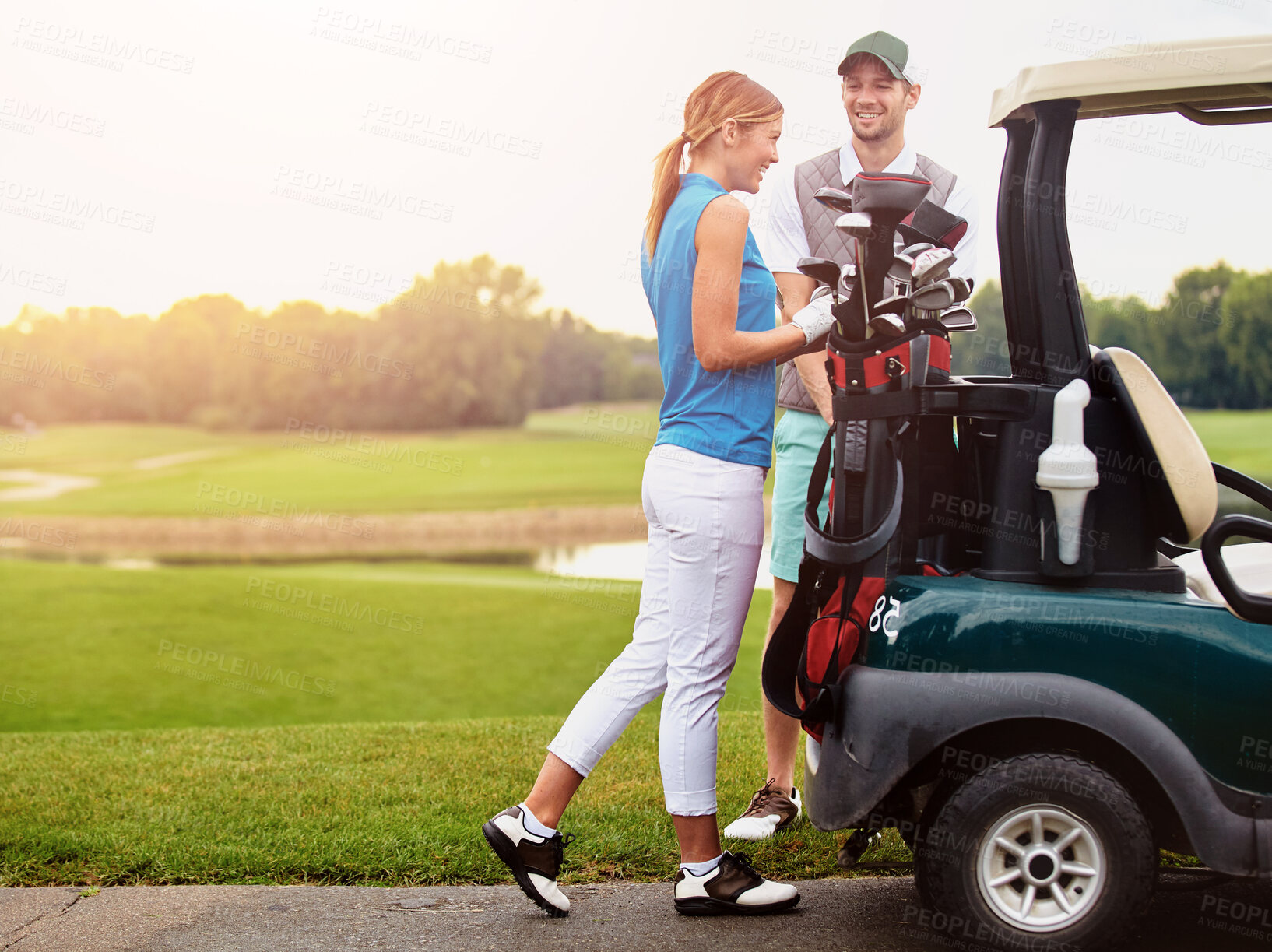 Buy stock photo Love, sports and vehicle with couple on golf course together for bonding, hobby or leisure. Grass. green and smile with happy man and woman golfing outdoor for holiday, relationship or vacation