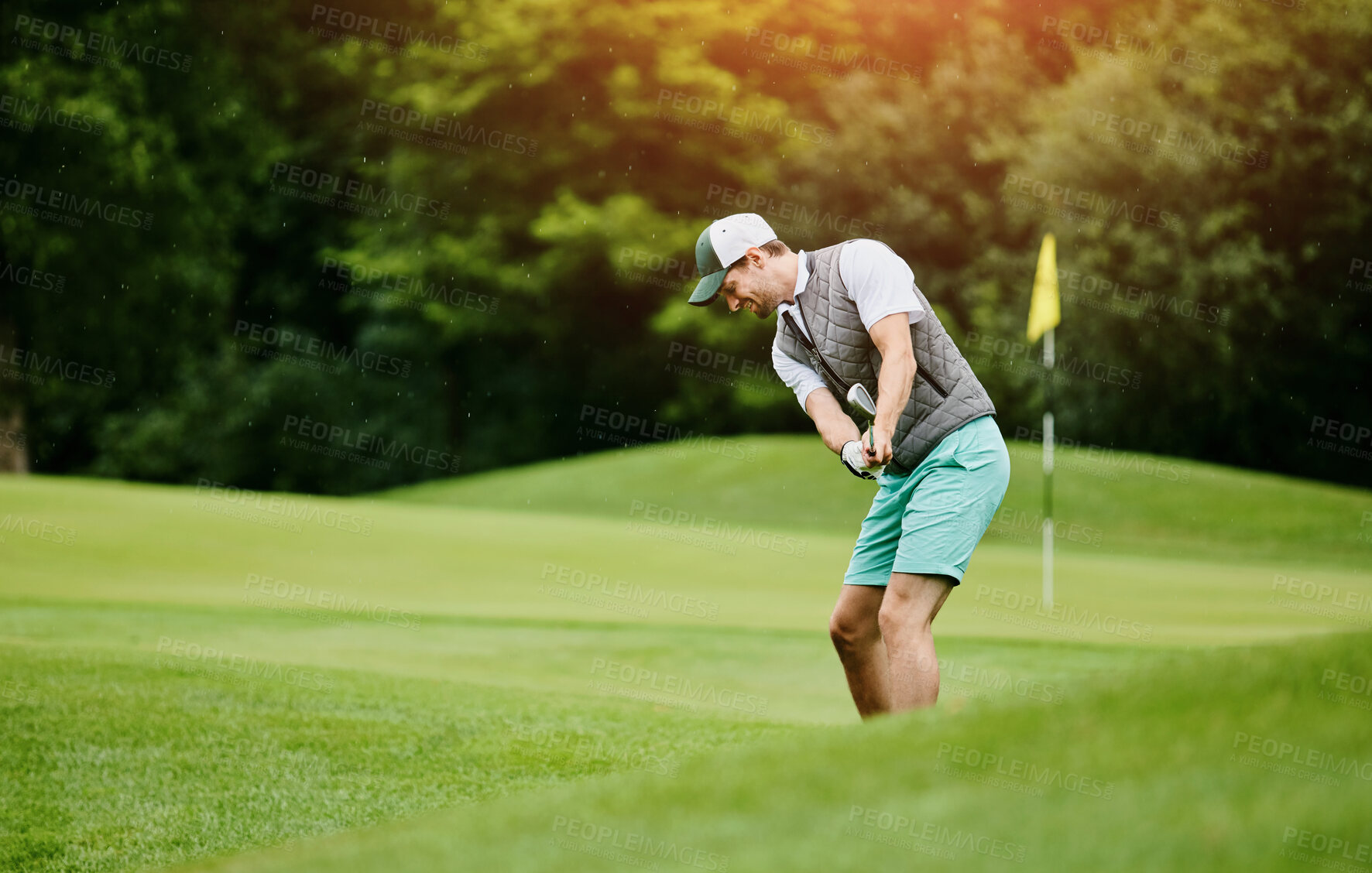 Buy stock photo Man, happy and playing golf at field as sports talent or professional skill and training. Hobby, activity and smile with swing at golfing course for tournament or competition and game for fitness 