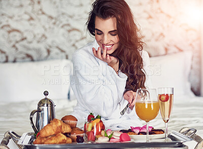 Buy stock photo Hotel, bed and woman with breakfast, taste or morning with healthy meal with food, hospitality or hungry. Person, eating or girl with nutrition, luxury or vacation with room service, break or comfort