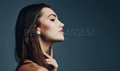 Buy stock photo Beauty, face and profile with natural woman in studio isolated on blue background mockup for skincare. Aesthetic, cosmetics and dermatology with confident model on space for satisfaction or thinking