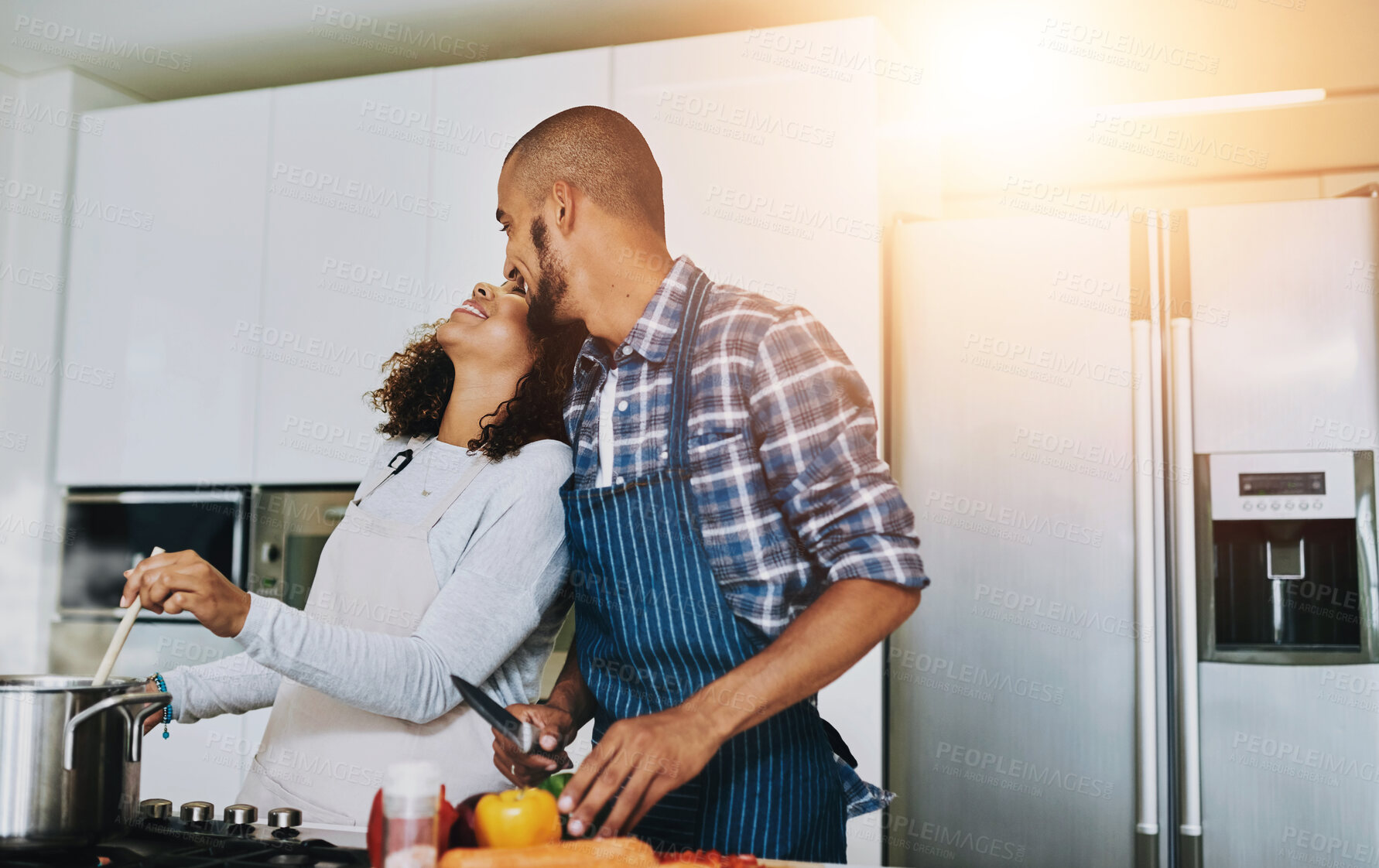 Buy stock photo Couple, love and cooking in kitchen at house for romantic dinner, happy and date with laughter. People, relationship and meal prep in home for bonding, wellness or eating food together with vegetable