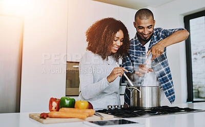 Buy stock photo Happy couple, cooking and romance in kitchen for lunch, trust and love in relationship. Man, woman and marriage at home for support, preparing meal and recipe with vegetables for anniversary dinner