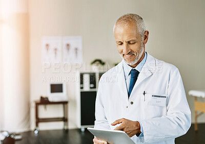 Buy stock photo Man, doctor and searching on tablet in clinic, online healthcare and telehealth or browsing for medical research. Wellness, research and hospital professional, diagnosis and internet consultation