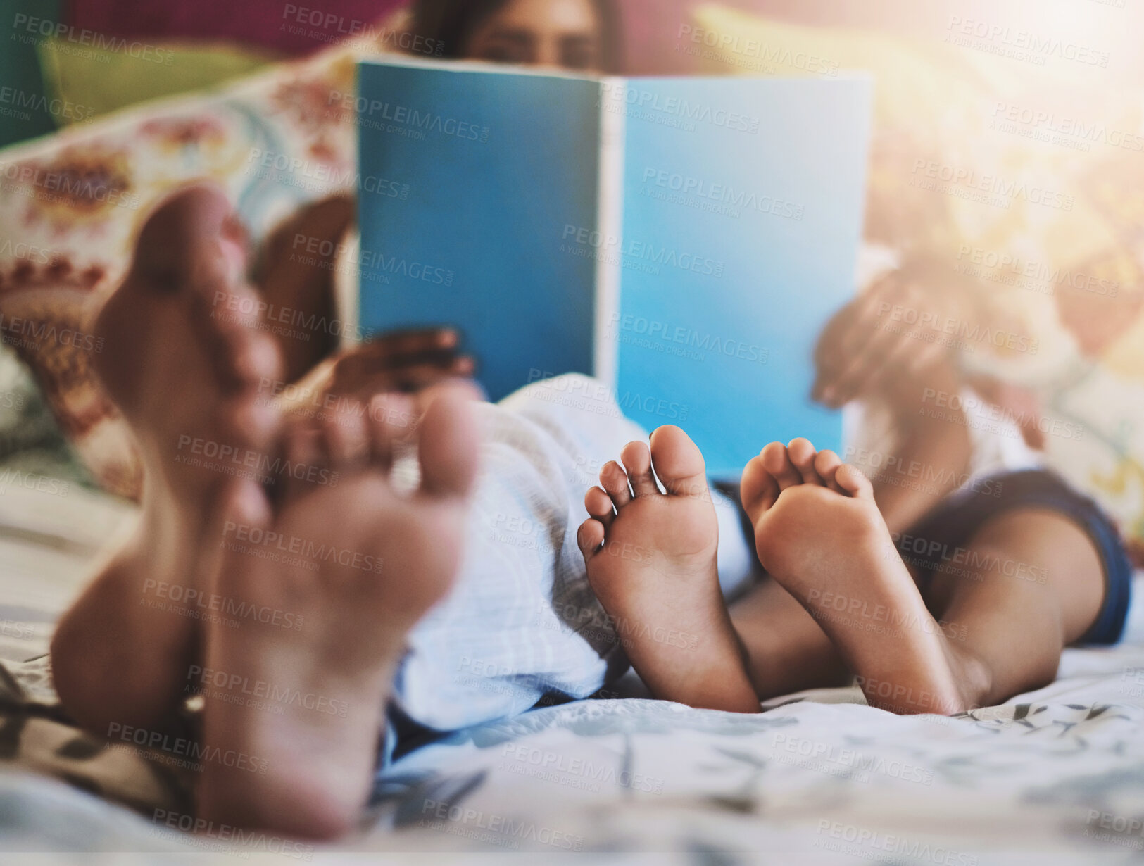 Buy stock photo Feet, bed or mother and child reading book in house for learning, support and bonding at home together. Love, family and kid with mom in bedroom with literature, fantasy and storytelling education