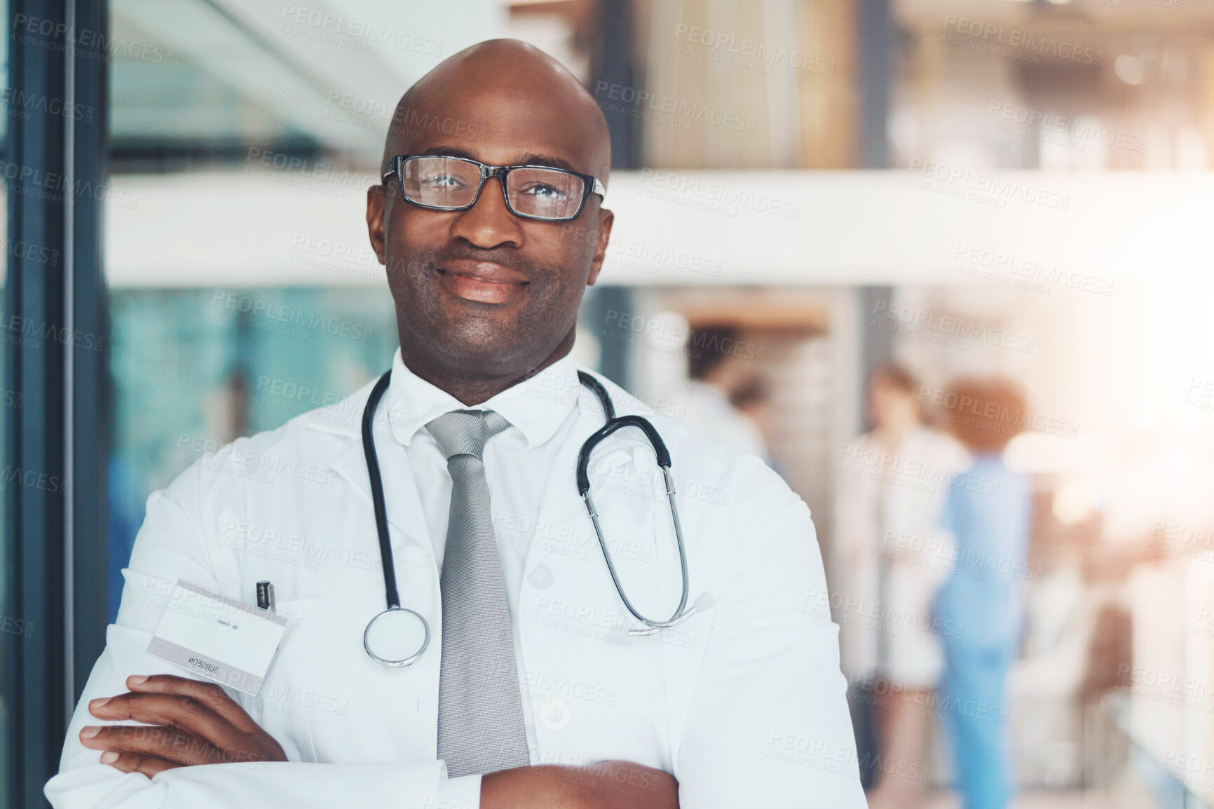 Buy stock photo Doctor, portrait and confidence of black man for healthcare, wellness or medical experience with stethoscope. Hospital, smile and pride in health facility with crossed arms for cardiology or medicine