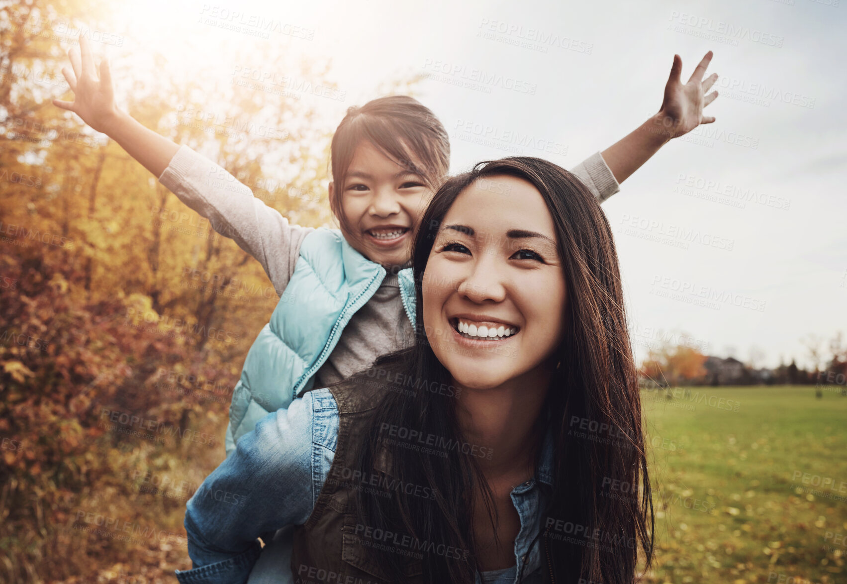 Buy stock photo Portrait, asian family and piggy back for fun, bonding together and countryside for vacation. Face, parent and girl with smile, outdoor and mother carrying kid, nature and holiday with game or energy