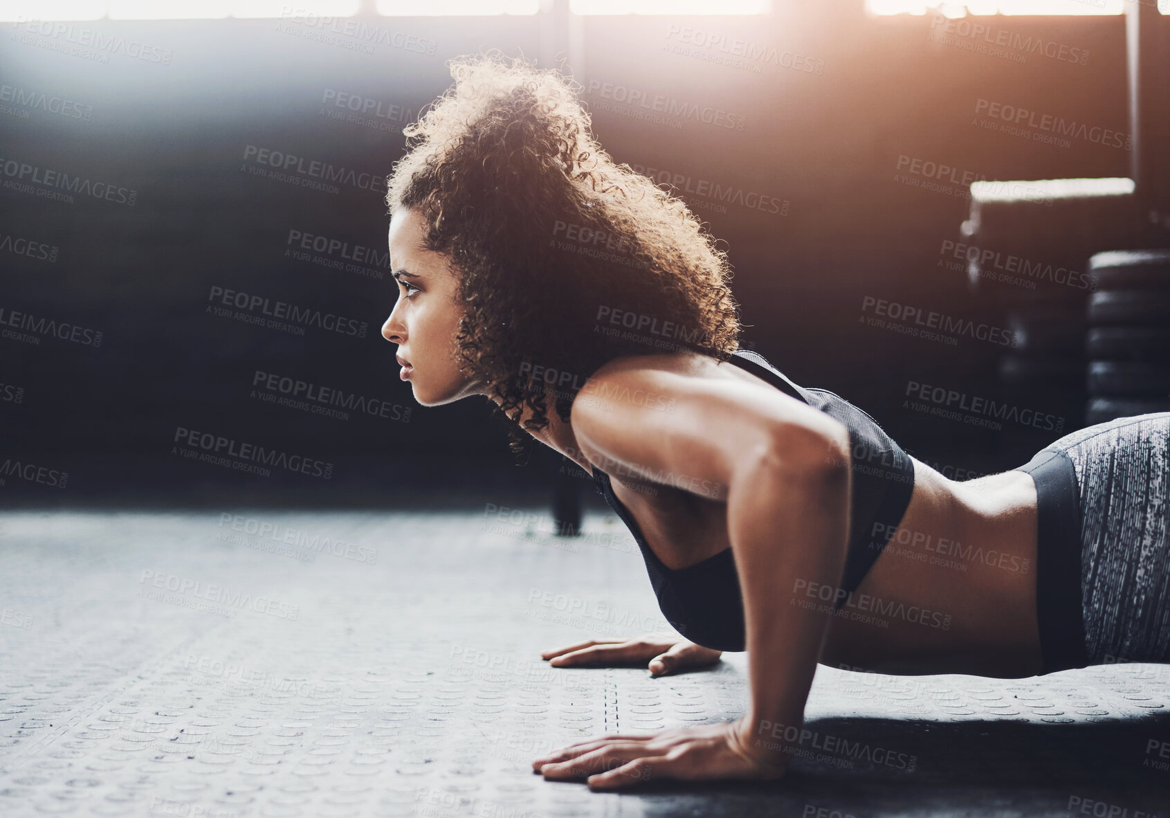 Buy stock photo Fitness, push up and serious with woman in gym for power, strength training or workout on floor. Exercise, health and wellness with confident athlete in sports center for challenge or performance