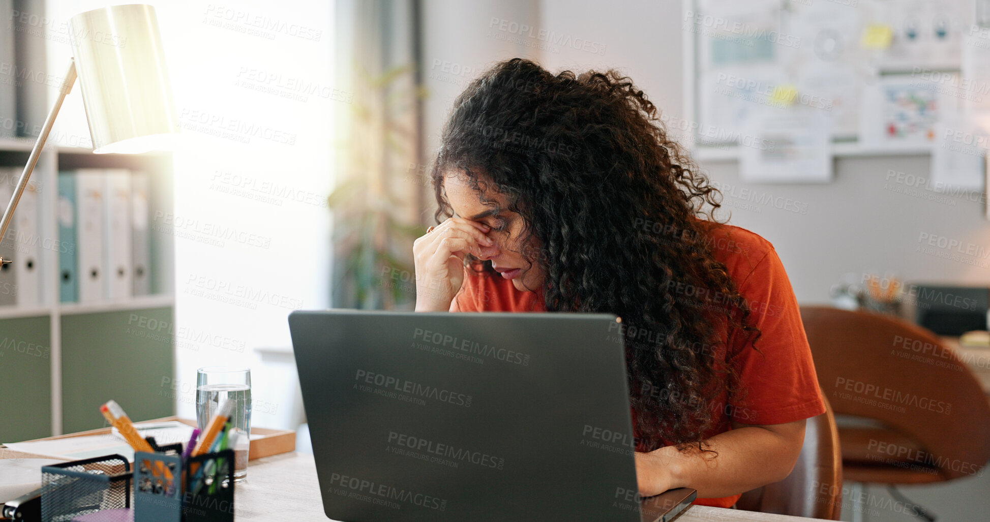 Buy stock photo Headache, woman and laptop at desk with stress, deadline and burnout in office. Female journalist, tired and frustrated at computer for review, article and anxiety in modern workplace in city