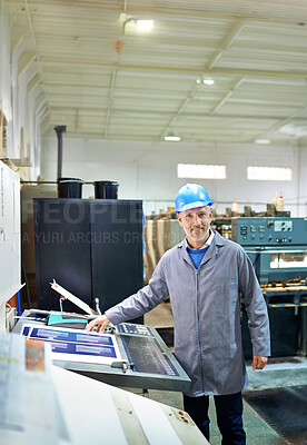 Buy stock photo Man, portrait and happy in factory for printing by machine, maintenance and production in workplace. Mature person, smile and helmet in industrial warehouse for design, brochure and press for paper
