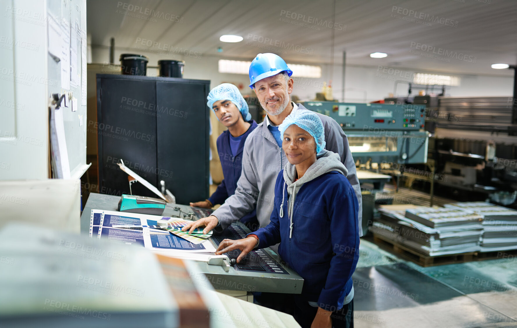 Buy stock photo Group, people and portrait in factory for printing by machine, color chart and production at job. Employees, woman and man in helmet at industrial warehouse for design, brochure or smile for teamwork