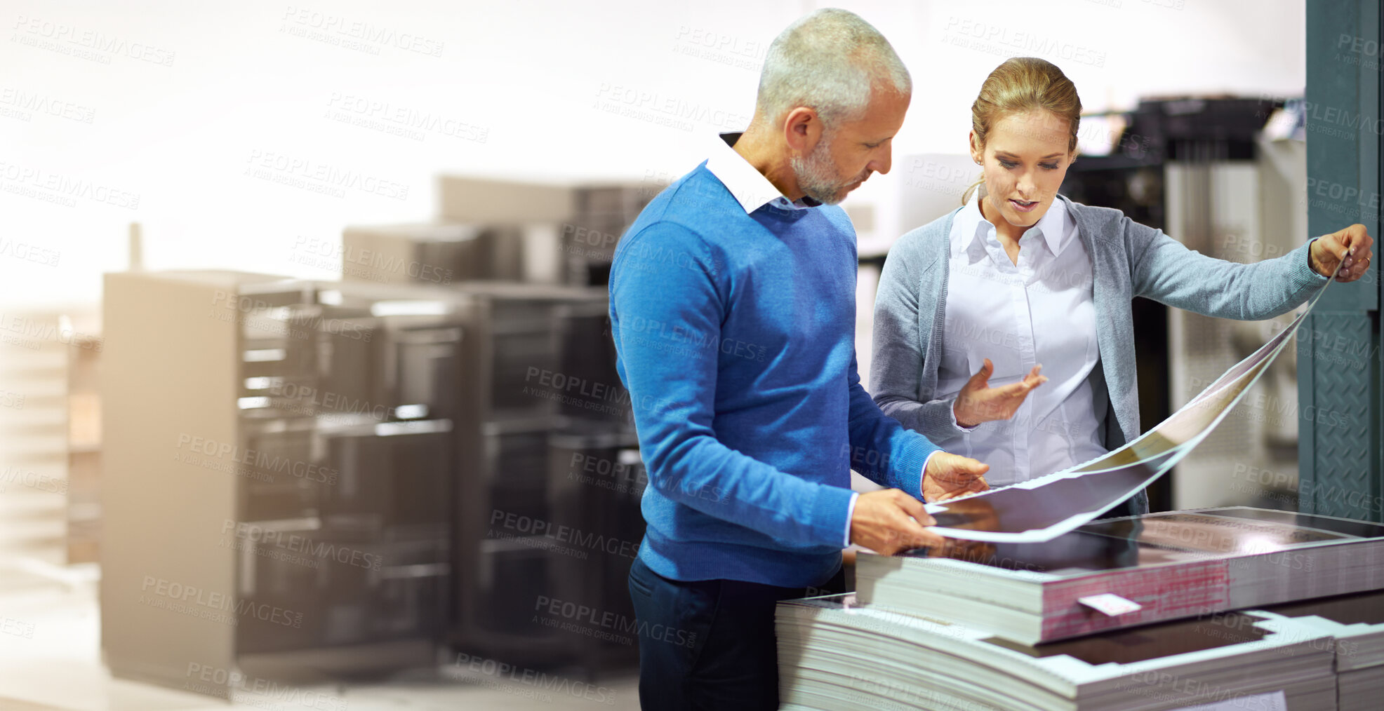 Buy stock photo Man, woman and printing in warehouse with check, creative manager or designers with teamwork. Business people, together and factory with inspection for publishing material, collaboration on project