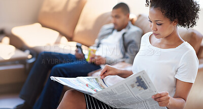 Buy stock photo Woman, reading and newspaper on sofa for article, information or knowledge on stock market in living room. Print, update and person with man for publication, newsletter or trending story in home