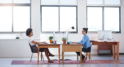 Buy stock photo Coworking, computer and business women in creative office while working on project together. Teamwork, technology and professional female employees planning company report in collaborative workplace