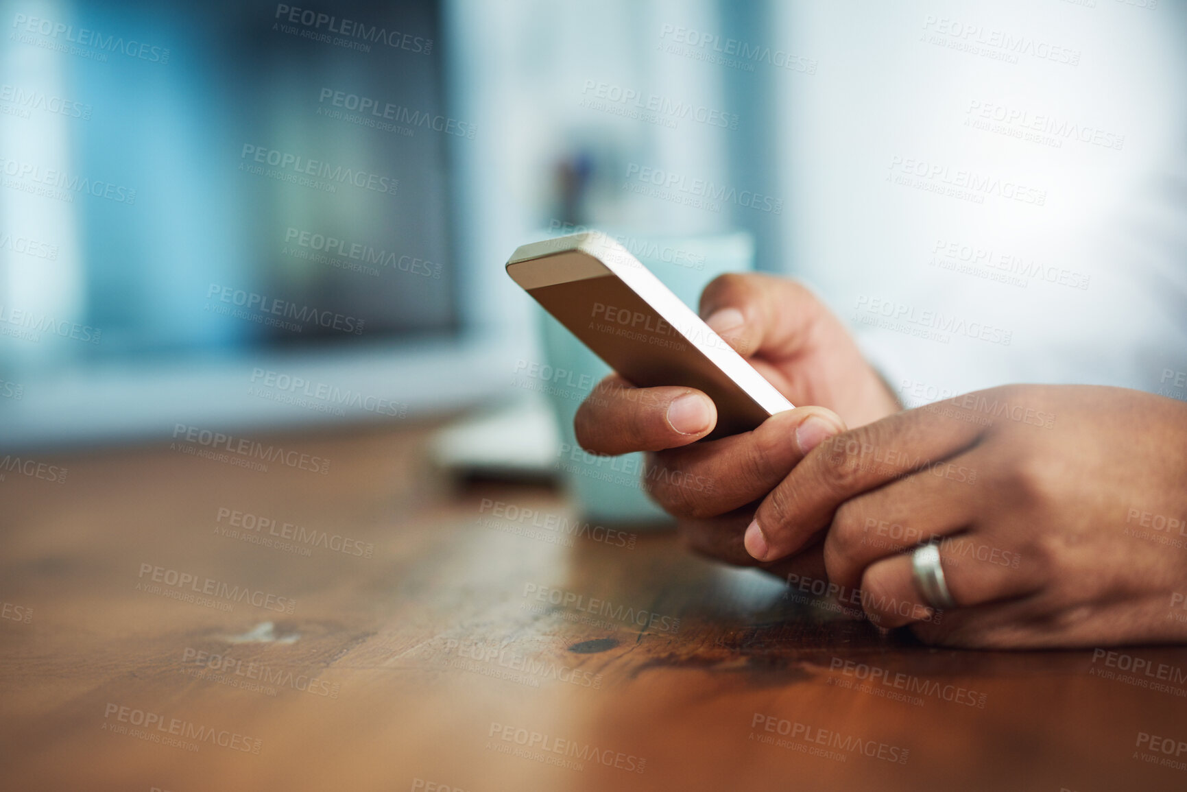 Buy stock photo Office, hands and person with smartphone on desk, chatting and text message with contact by mockup. Closeup, businessman and mobile app for networking, reading information and social media on table