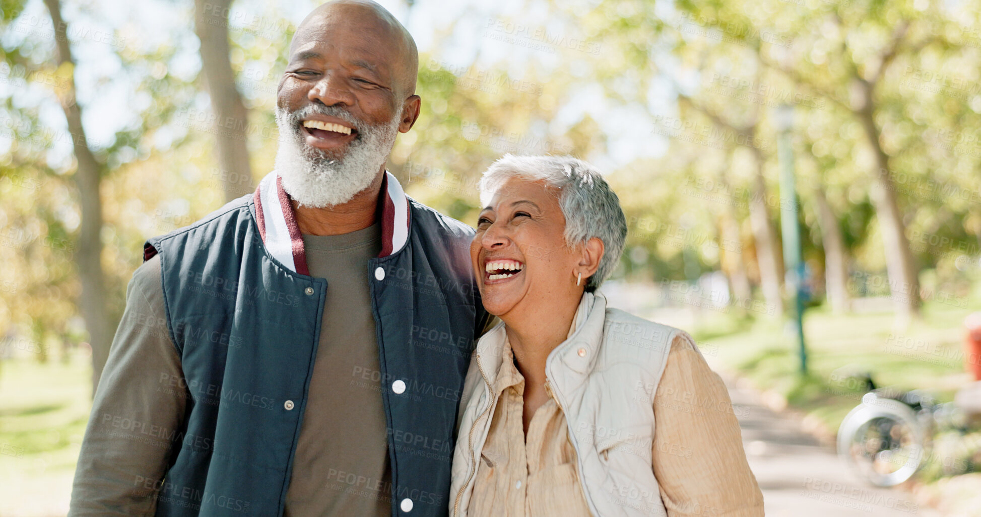 Buy stock photo Love, laugh and senior couple in park for walk, exercise and fitness in retirement in nature or forest. Partner, diverse and support or trust for man and female person, care and hug or embrace