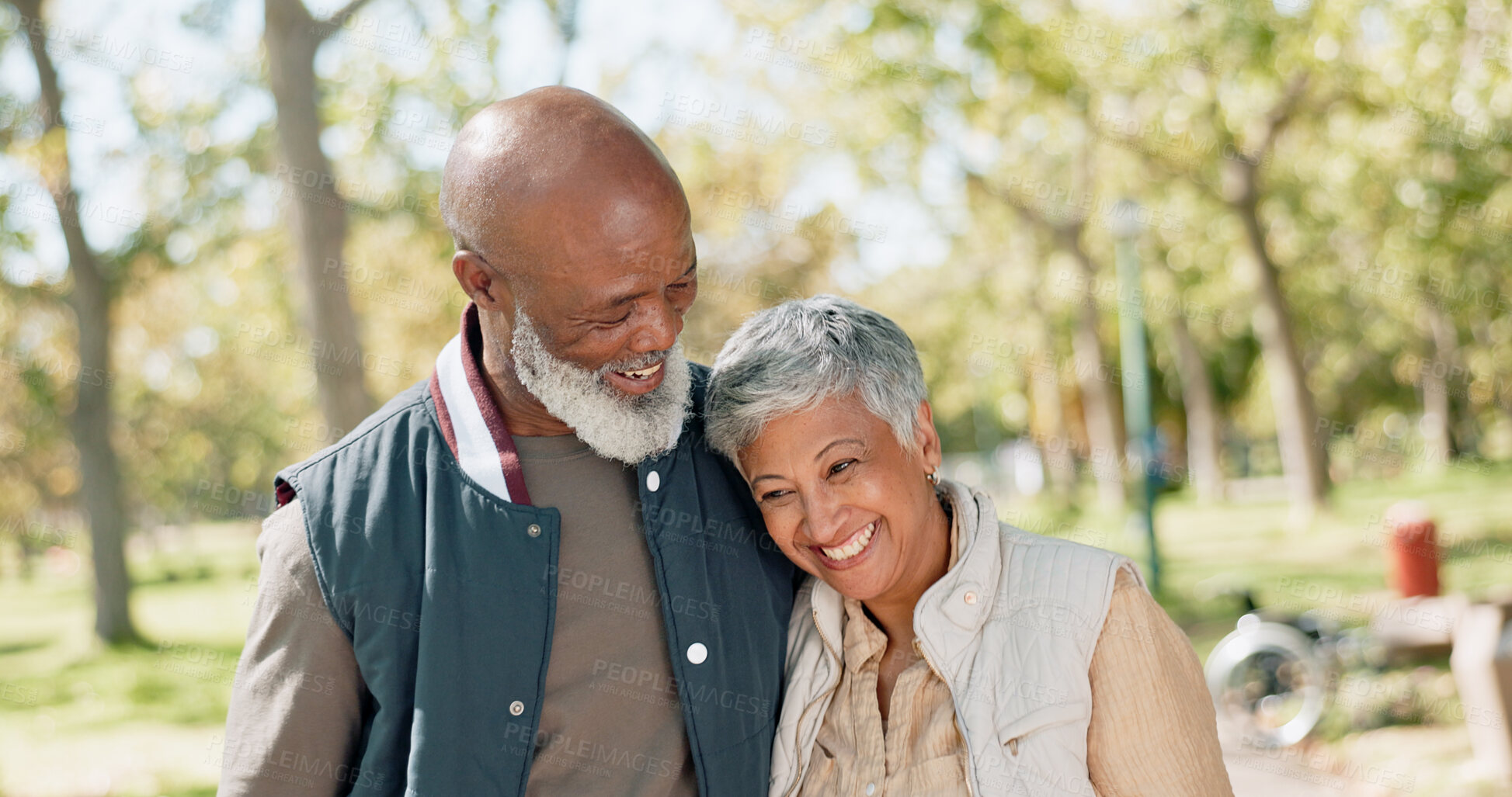 Buy stock photo Love, happy and senior couple in park for walk, exercise and fitness in retirement in nature or forest. Partner, diverse and support or trust for man and female person, care and hug or embrace