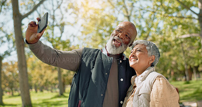 Buy stock photo Senior couple, selfie and hug in park with love, support or photography outdoor for holiday, travel or vacation. Interracial people in profile picture, vlogging or bonding with smile in New York, USA