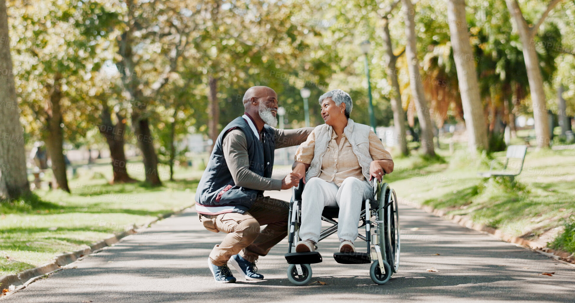 Buy stock photo Senior, couple and people with disability in park for fresh air, walking and enjoyment of retirement or wellness with love. Man, woman and outdoor in garden for bonding, together and wheelchair.