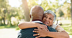 Love, hug and senior couple in park for walk, calm and talking in retirement in nature or forest. Partner, diverse and support or trust for man and female person, care and conversation together