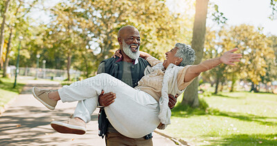 Buy stock photo Senior, couple and carrying in park with love for bonding with laughter, happiness and romance in nature with affection. Man, woman and together outdoor with wellness or fun, enjoyment and support.