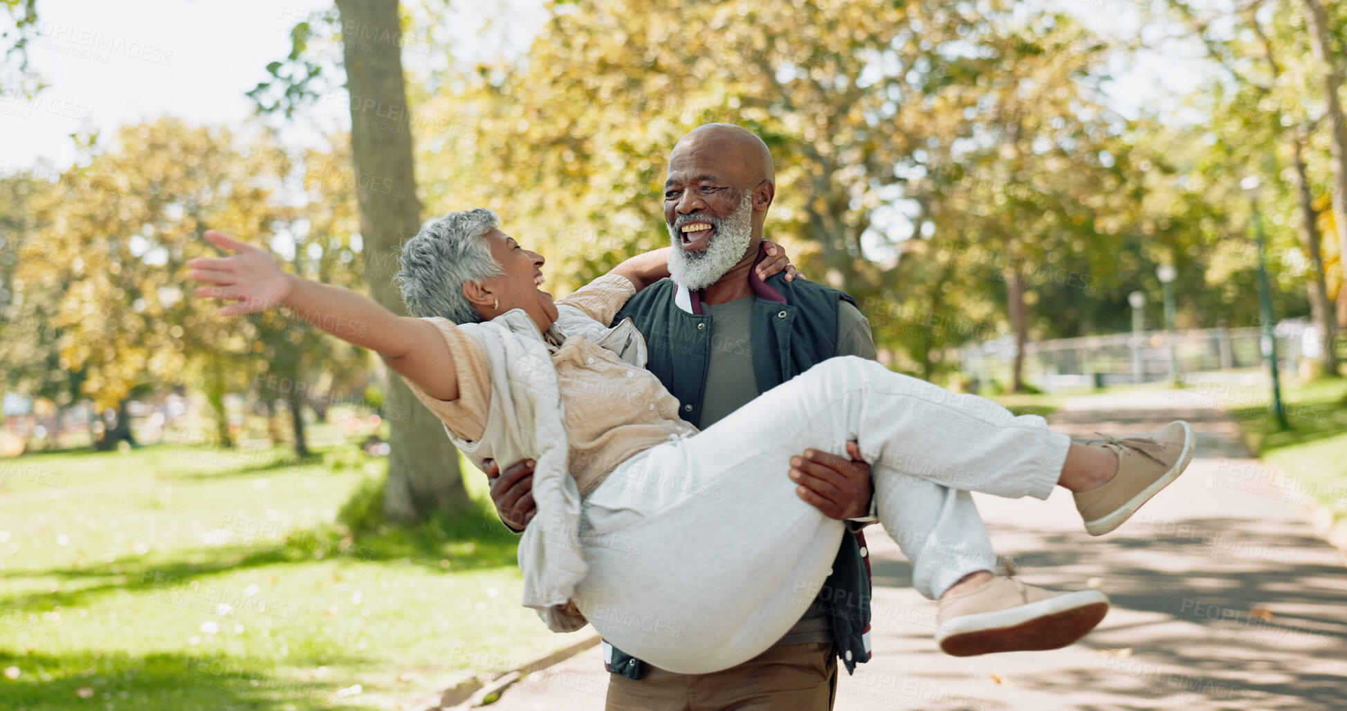 Buy stock photo Senior, couple and playful in park with care for bonding with laughter, happiness and romance in nature with affection. Man, woman and together outdoor with wellness or fun, enjoyment and support.