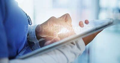 Buy stock photo Hands, communication and doctor with tablet in hospital for telehealth, networking or connectivity. Light, email and female healthcare worker with digital technology for medical research in clinic.