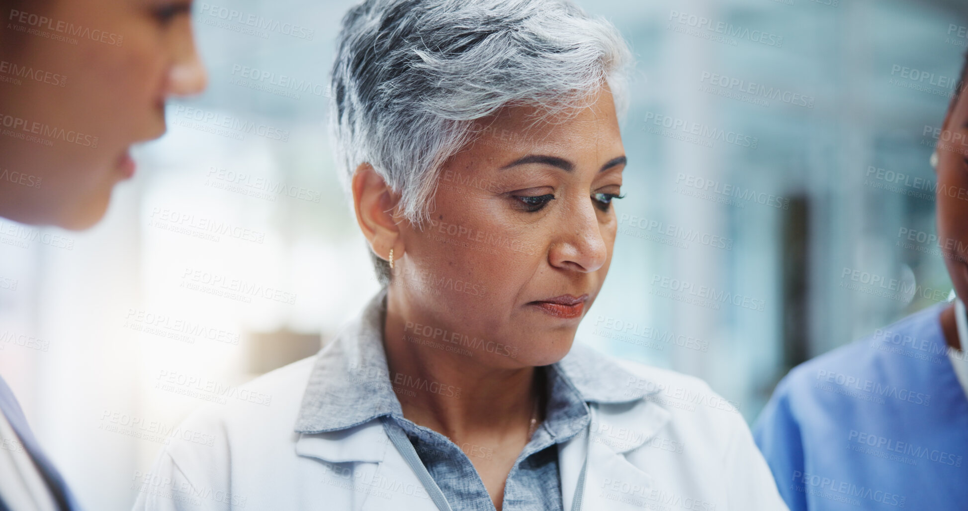 Buy stock photo Female doctor, teamwork and closeup in hospital for discussion in workplace with leader. Collaboration, communication and medical research for innovation in medicine with healthcare professional.