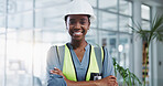 Construction worker, portrait and black woman with arms crossed for confidence, engineering or project management. Smile, contractor and person for maintenance, building renovation or architecture