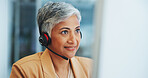 Call centre, mature woman and headphone in office as telemarketing agent, customer support or communication with client. Person, consultant and offer advice, telecom or solution for product placement