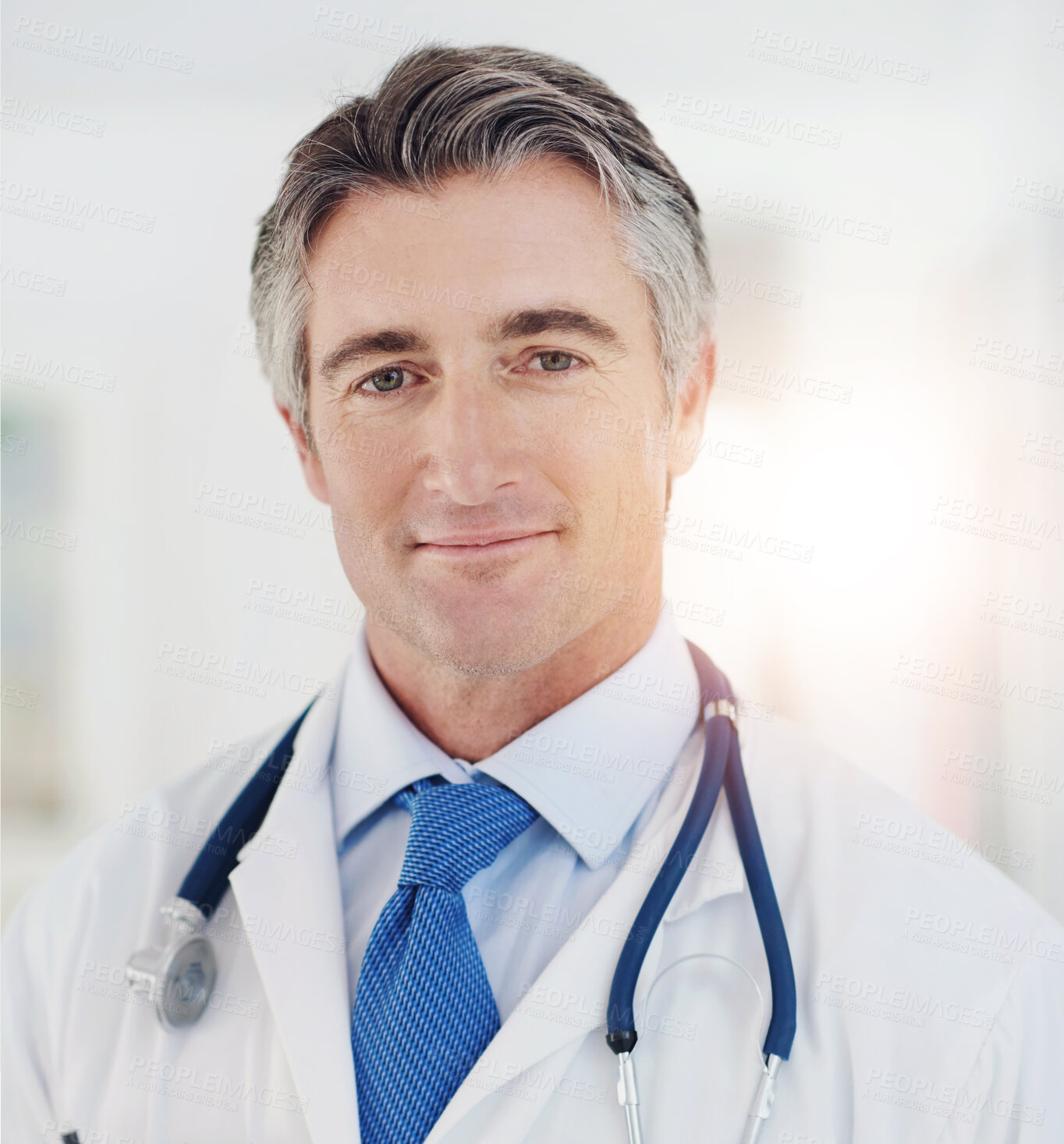 Buy stock photo Portrait, doctor and man in clinic, healthcare and stethoscope with wellness, white coat and pride. Face, person or medical with professional, tools and employee with cardiology or expert in hospital