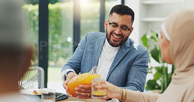 Buy stock photo Smile, juice and muslim family in home for breakfast, bonding and healthy dish together. Happy, love and islamic man pour nutrition fruit drink for wife at morning meal in dining room at house.