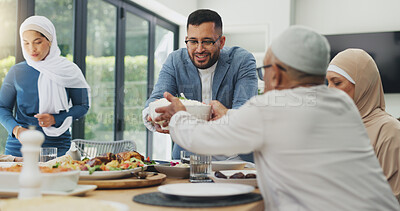 Buy stock photo Muslim family, social gathering and food for celebration of Eid, healthy meal and conversation in house. Islamic people, grandparents and mother with father, lunch and happiness with salad and relax