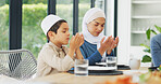 Mother, praying and Muslim family with food to say prayer or dua before Eid dinner on holy month of Ramadan. Religion, Islamic or grateful child ready to eat for breaking fast or iftar meal at home