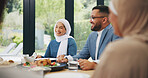 Islamic, family and dinner in home for eid, muslim celebration and serving food on dining table. Ramadan, culture and religious gathering with conversation, eating and people bonding with lunch