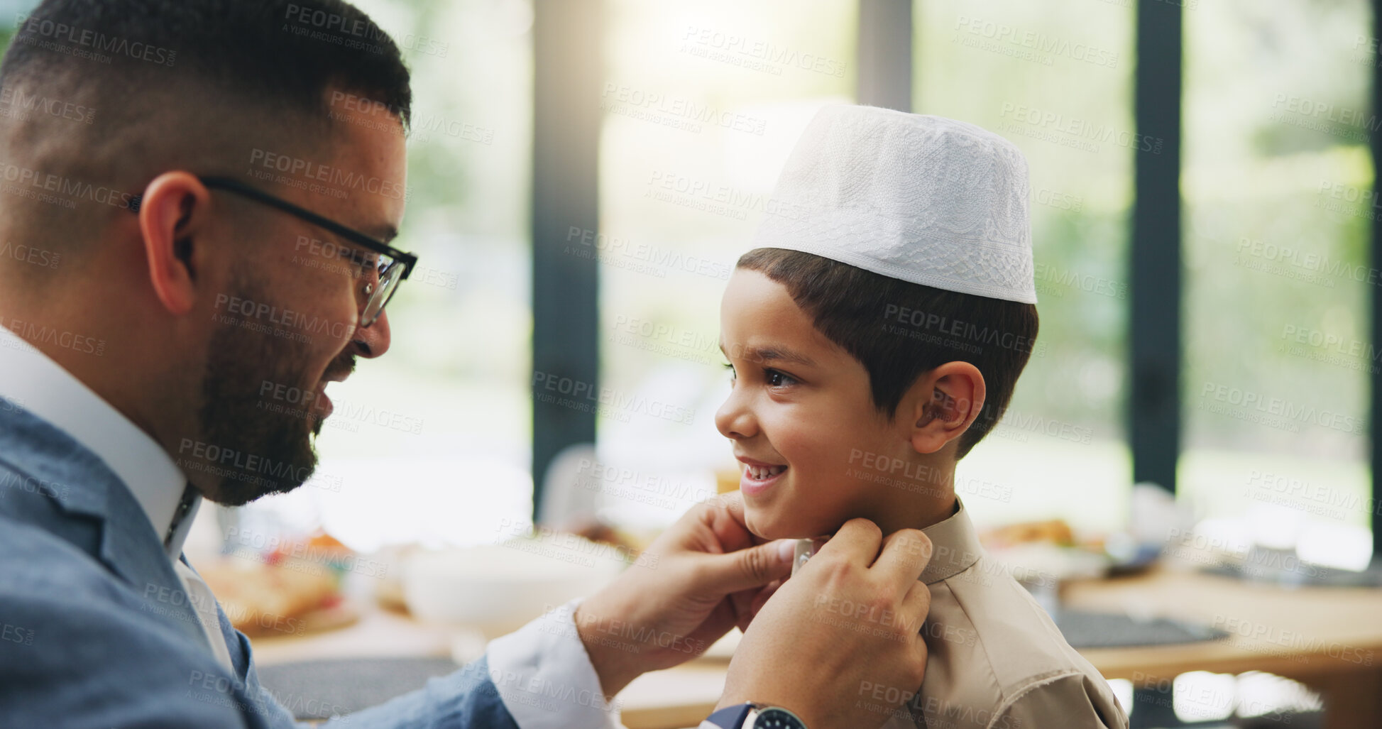 Buy stock photo Muslim, dad and dressing of child in home, celebration and holiday of Eid al Fitr, religion and clothes for culture. House, man and son in dining room, ready and happy for Ramadan, festive and feast