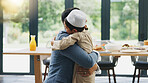 Muslim, father and son with hug at home for hello, reunion and bonding together before dinner. Family, dad and child or boy with embrace for welcome gesture, greeting and support with care in house