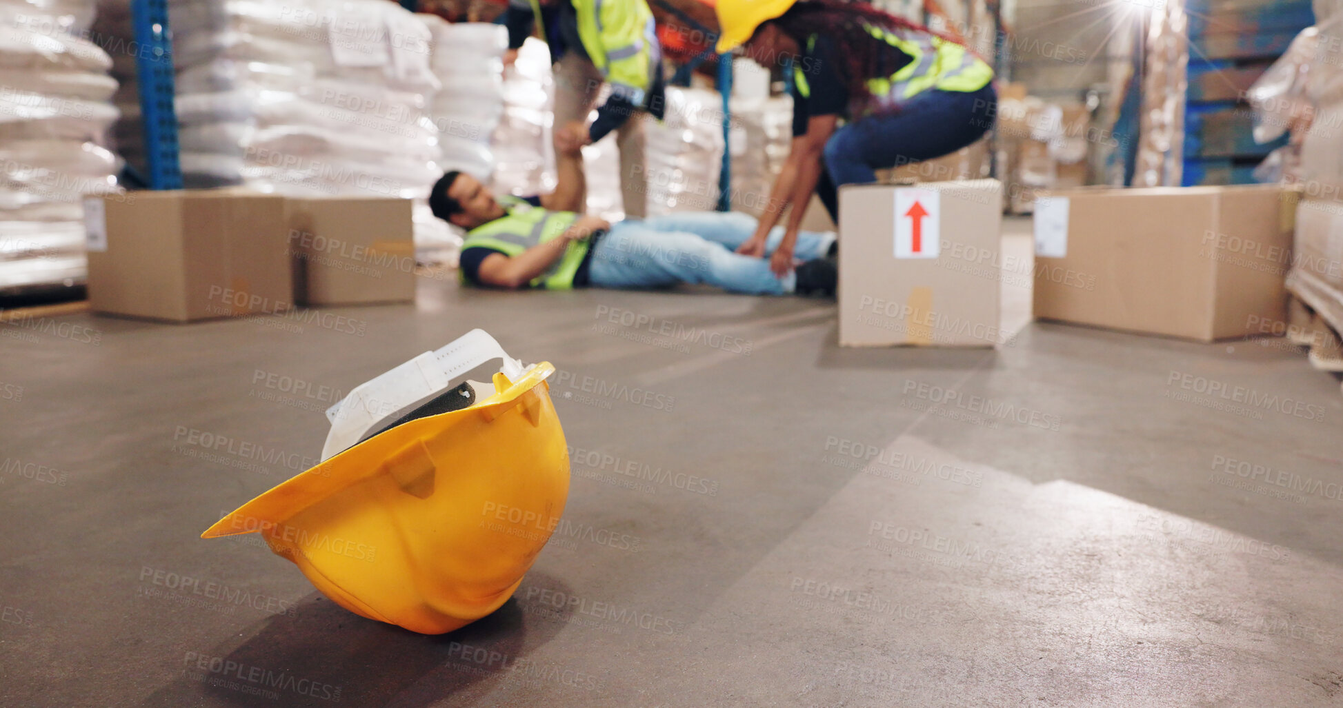 Buy stock photo Accident, fall and helmet with man in warehouse for delivery, distribution or supply chain logistics. Fail, hardhat or injury and person on floor of plant with box for ecommerce, retail or safety