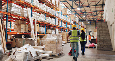 Buy stock photo People, warehouse and storage for logistics with boxes, shelf and teamwork at global shipping company. Man, woman and back with trolley for package, distribution or supply chain in industrial factory