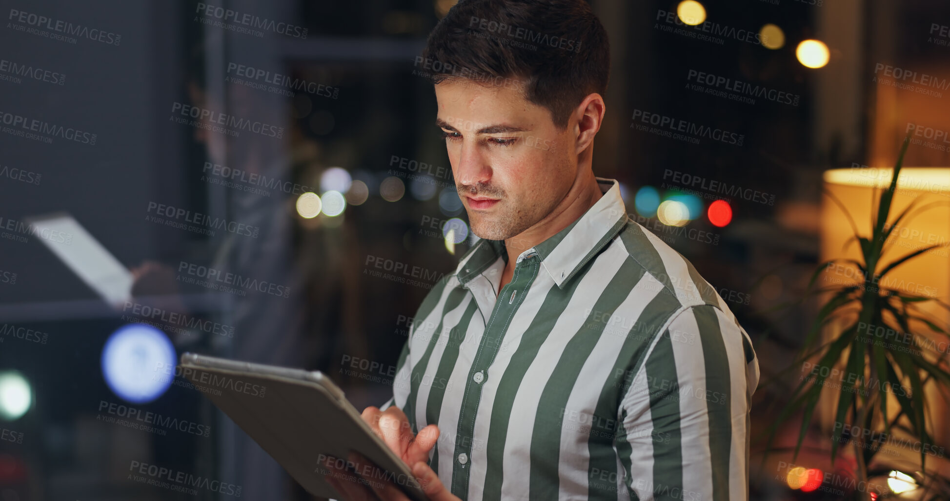 Buy stock photo Night, business and man with tablet, typing and internet with research for proposal, thinking and stock market. Person, evening or employee with tech, professional and website for trading or planning