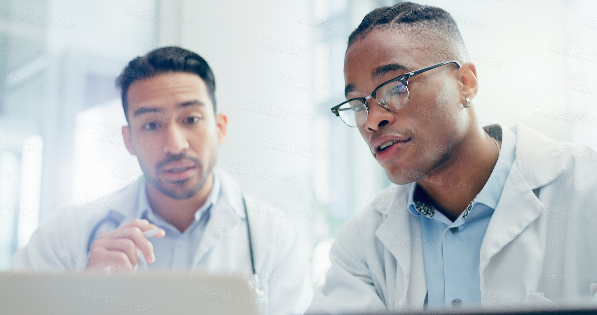 Buy stock photo Meeting, doctors and men in clinic with laptop for discussion, treatment plan or diagnosis. Talking, healthcare and medical professionals with technology for conversation, teamwork or collaboration