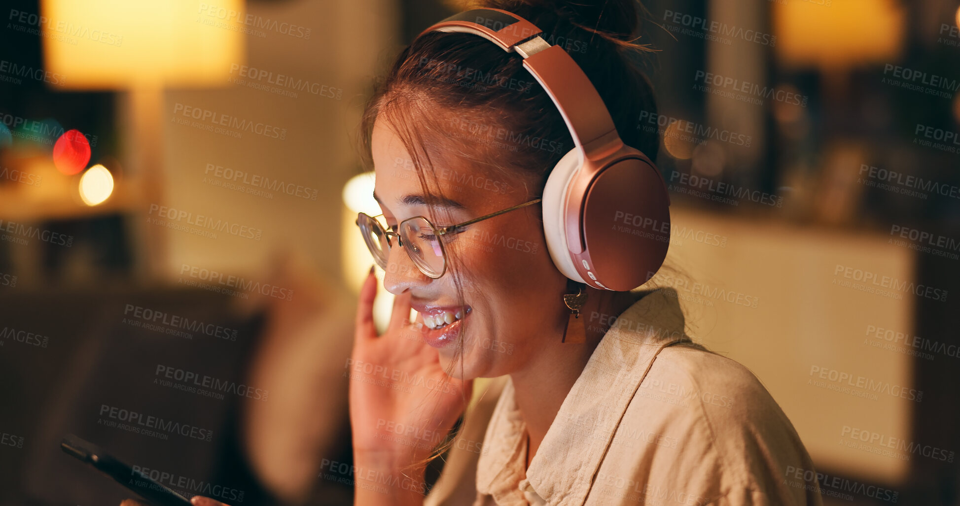 Buy stock photo Happy, woman and night for remote work with headphones, enjoy and listening to music. Female designer, overtime and technology at home for audio book, funny story and entertainment in living room