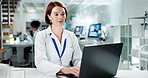Scientist, woman and typing on laptop in lab, medical professional and bioinformatics analysis online or research study. Innovation, information and working, recording experiment and data development